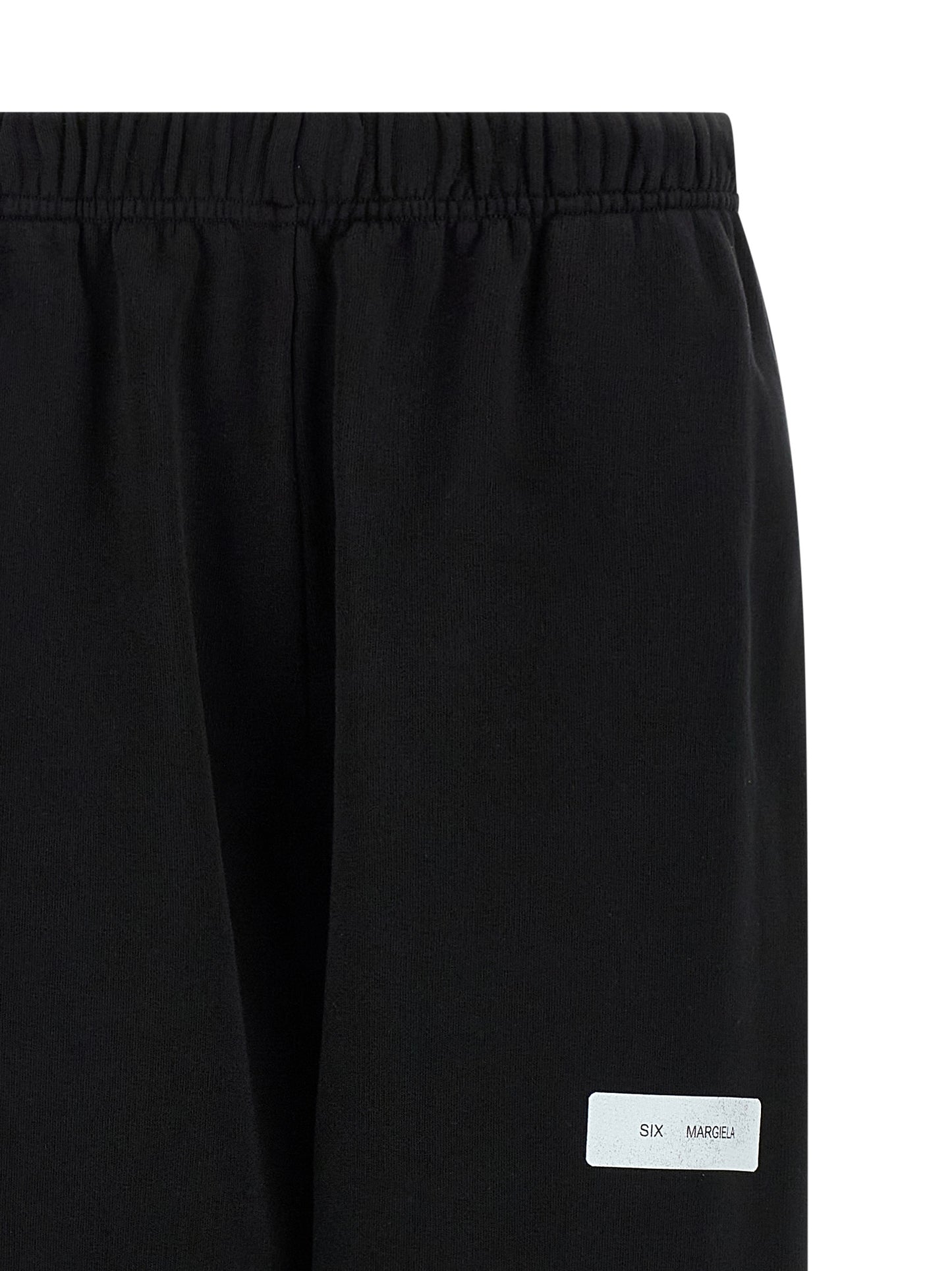 Joggers by MM6 Maison Margiela for women in cotton black & print presents a tailored silhouette, showcasing a tailored and long cut with a refined for a truly tailored aesthetic.
