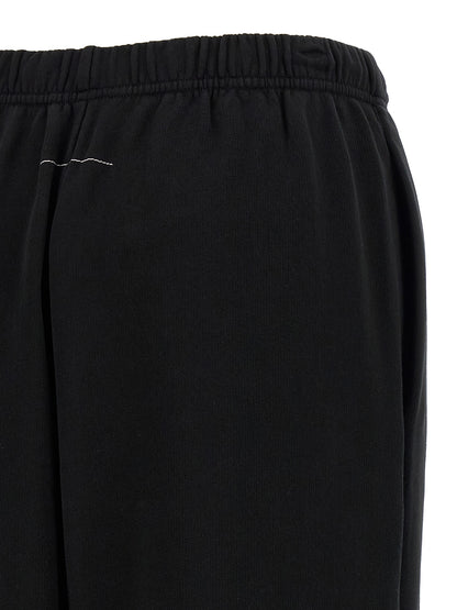 Joggers by MM6 Maison Margiela for women in cotton black & print presents a refined pantology silhouette, artfully defined by a refined pantology , long, and a sophisticated .