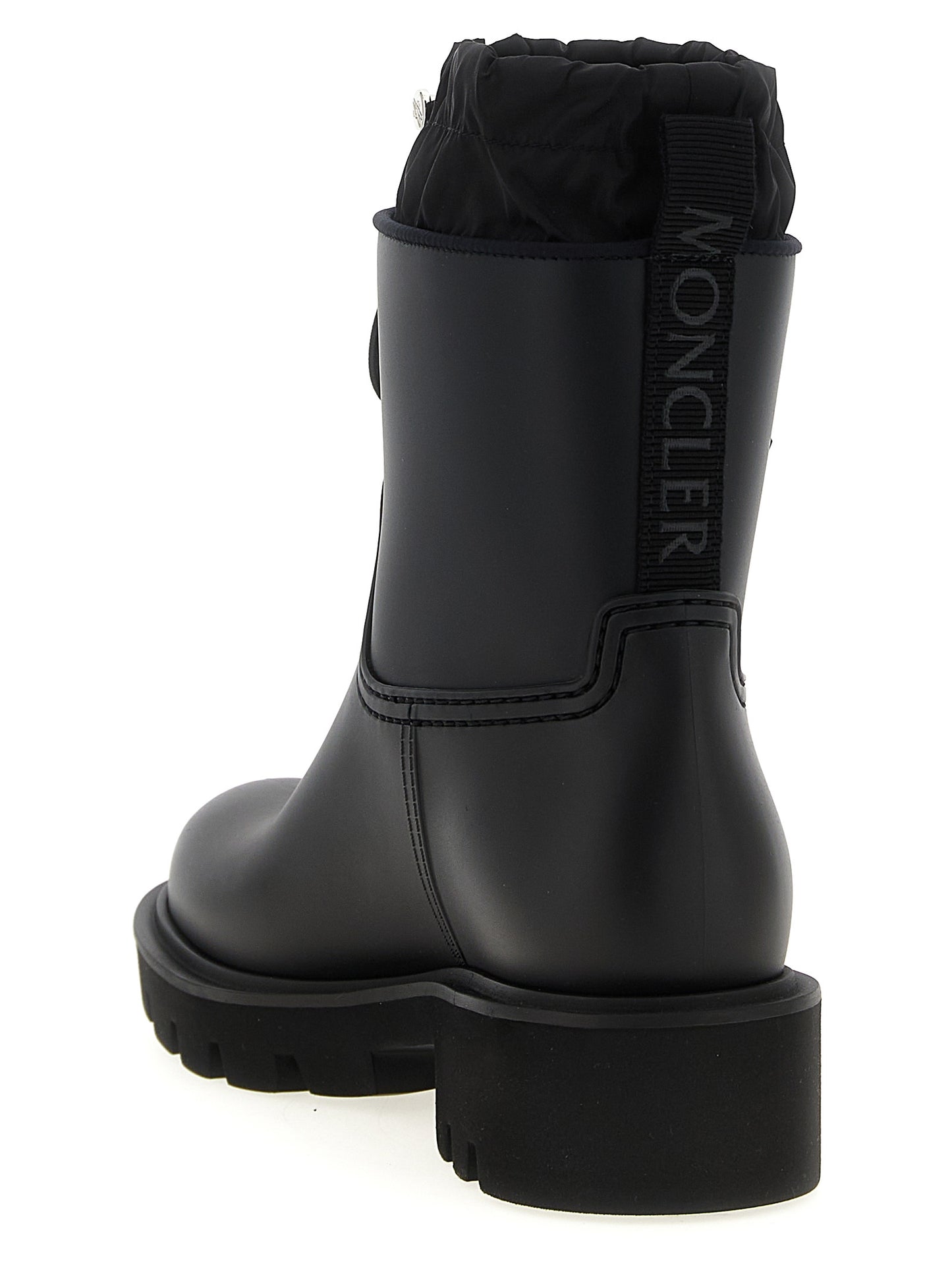 Ankle Rain Boots by Moncler for women in nylon eva & pvc black features an high-performance silhouette, showcasing the sophisticated design of the The Blend Women's Nylon EVA & PVC Ankle Rain Boots with a and a refined .