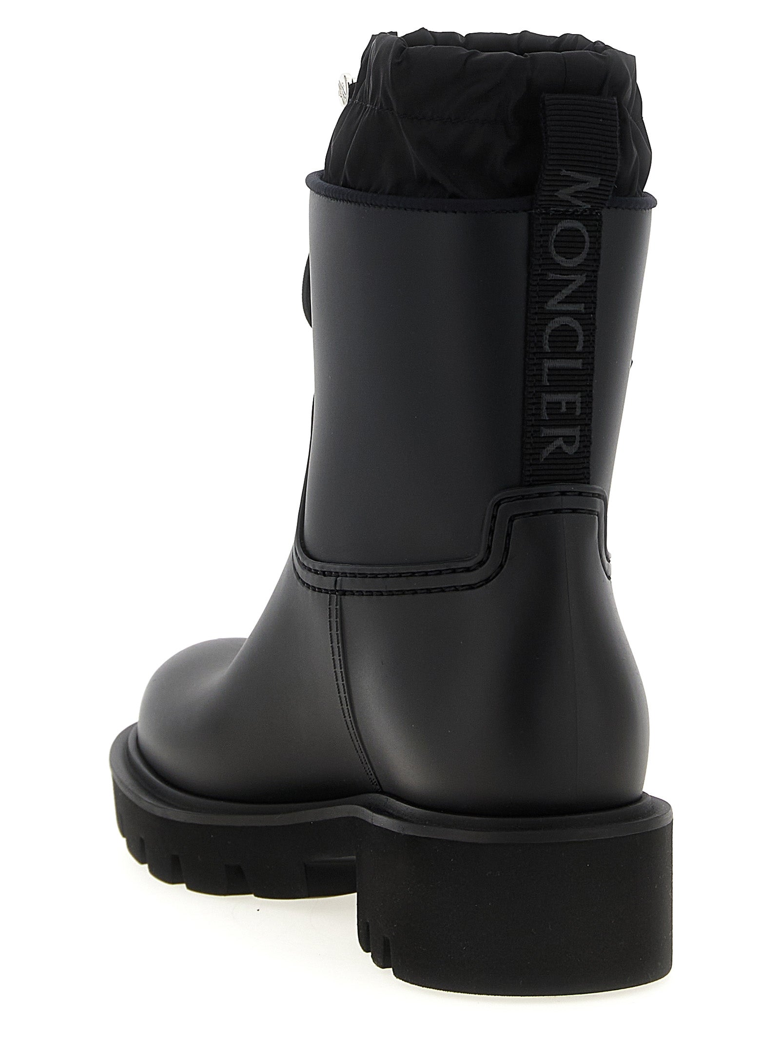 Ankle Rain Boots by Moncler for women in nylon eva & pvc black features an high-performance silhouette, showcasing the sophisticated design of the The Blend Women's Nylon EVA & PVC Ankle Rain Boots with a and a refined .