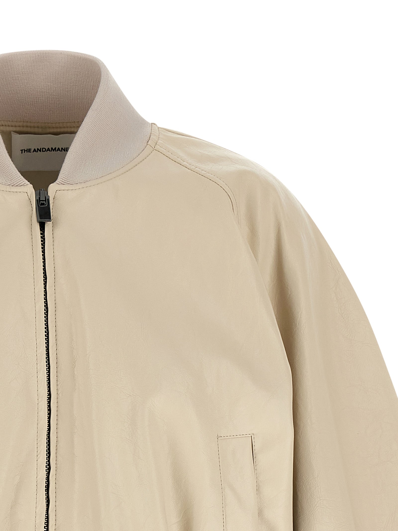 Bomber Jacket by The Andamane for women in polyester polyamide polyurethane leather & cotton beige presents a effortlessly chic silhouette, showcasing a sophisticated high-neck neckline and premium pockets for a truly effortlessly chic finish.