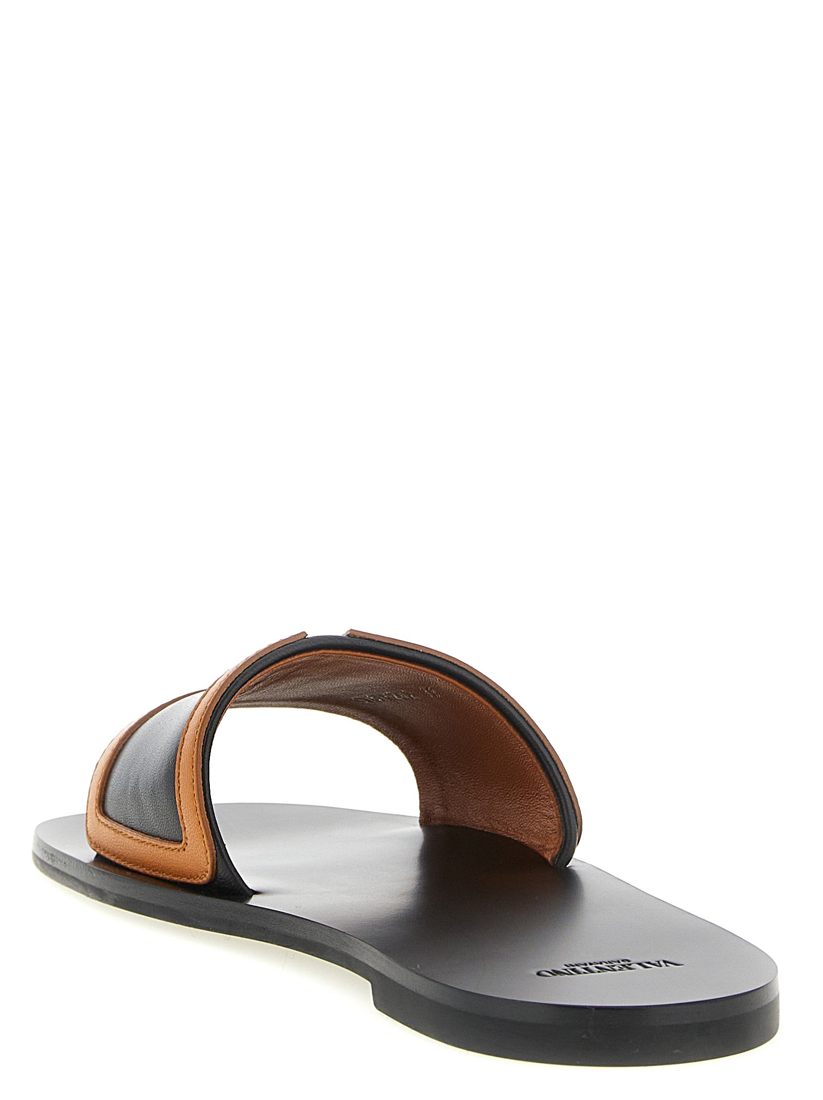 Sliders Flat Shoes by Valentino Garavani for women in lamb leather brown & signature features an statuesque silhouette from the Viva Superstar V Logo Women's Lamb Leather Sliders Flat Shoes collection, showcasing a and a statuesque for a statuesque look.
