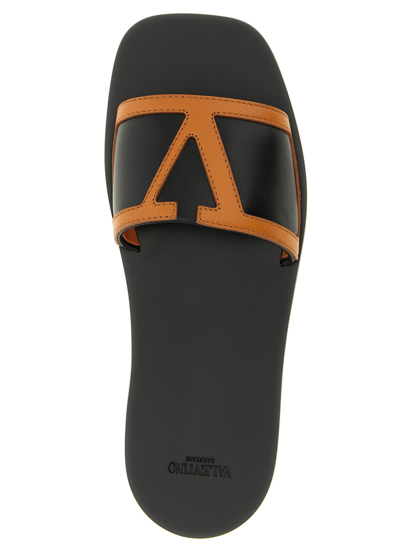 Sliders Flat Shoes by Valentino Garavani for women in lamb leather brown & signature showcases a dynamic silhouette, artfully capturing Viva Superstar V Logo Women's Lamb Leather Sliders Flat Shoes through its distinctive and elegant .