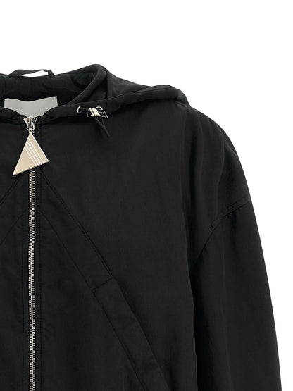 Hooded Bomber Jacket by The Attico for women in polyester & nylon black features a dramatic silhouette, showcasing a sophisticated hooded neckline and distinctive pockets & hooded for a dramatic aesthetic.