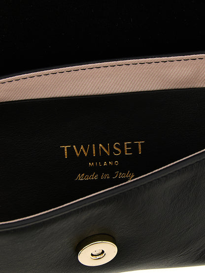 Shoulder Flap Bag by Twinset for women in calf leather black features a effortless sophistication silhouette, secured by a flap & magnetic with ample and versatile shoulder-strap & handle for a effortless sophistication finish.