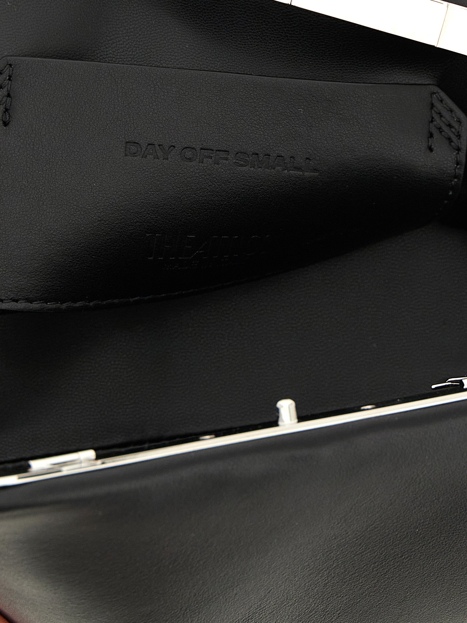Small Evening Clutch Handbag by The Attico for women in calfskin leather black features a sculptural silhouette with a secure snap, ample , and versatile shoulder-strap & adjustable-strap for a sculptural finish.