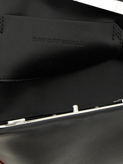 Small Evening Clutch Handbag by The Attico for women in calfskin leather black features a sculptural silhouette with a secure snap, ample , and versatile shoulder-strap & adjustable-strap for a sculptural finish.