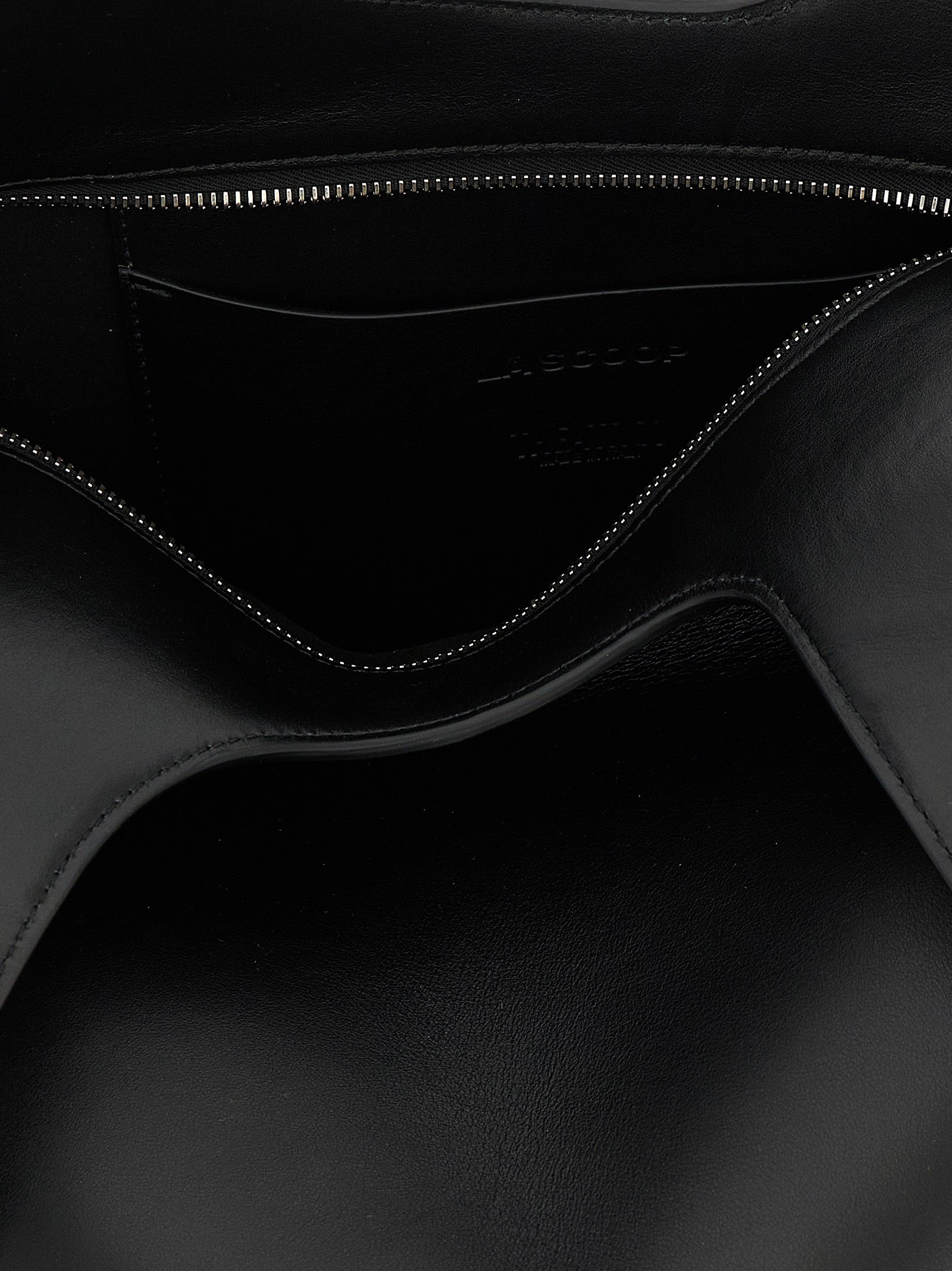 Medium Shoulder Bag by The Attico for women in calfskin leather black presents a statuesque silhouette, showcasing a secure zipper and statuesque with versatile shoulder-strap & handle for a sophisticated look.