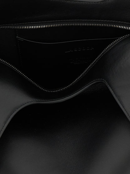 Medium Shoulder Bag by The Attico for women in calfskin leather black presents a statuesque silhouette, showcasing a secure zipper and statuesque with versatile shoulder-strap & handle for a sophisticated look.