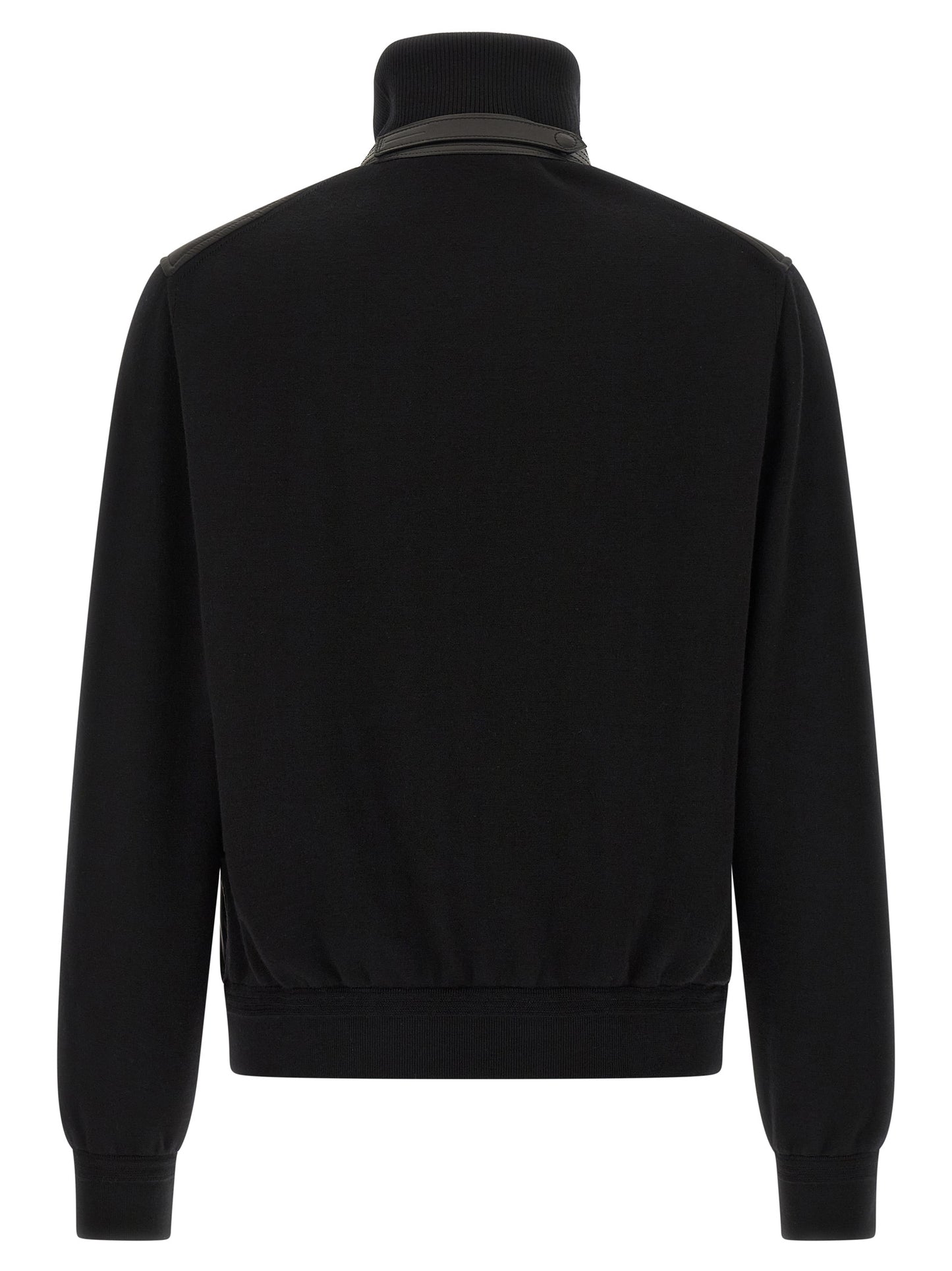 This Bomber Jacket by Tom Ford for men in nylon polyamide leather & merino wool black exhibits a edgy silhouette, meticulously detailed with functional pockets & insulated and a edgy high-neck neckline for a edgy finish.