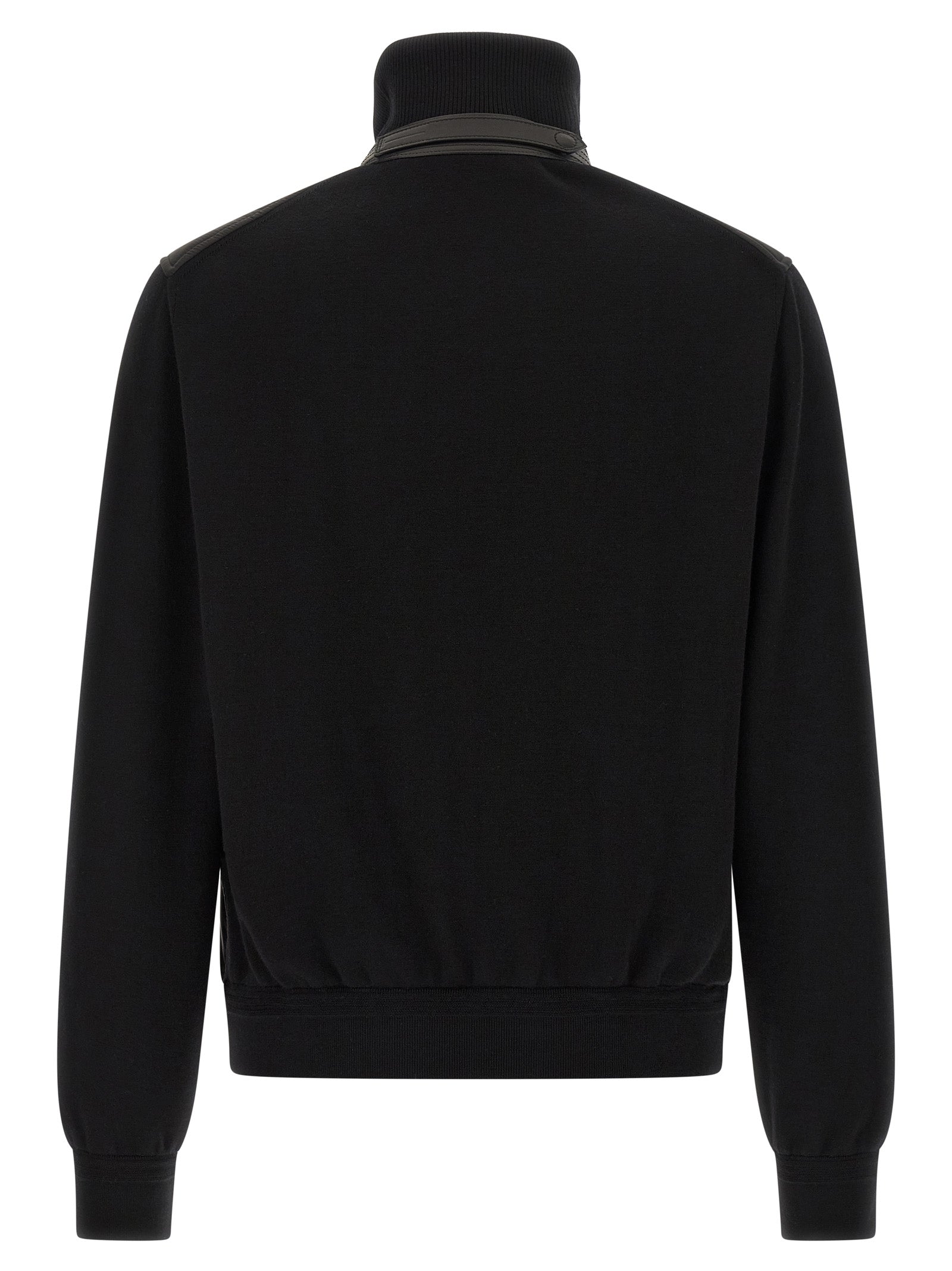 This Bomber Jacket by Tom Ford for men in nylon polyamide leather & merino wool black exhibits a edgy silhouette, meticulously detailed with functional pockets & insulated and a edgy high-neck neckline for a edgy finish.