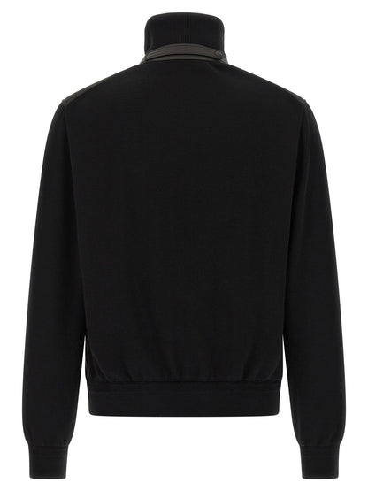 This Bomber Jacket by Tom Ford for men in nylon polyamide leather & merino wool black exhibits a edgy silhouette, meticulously detailed with functional pockets & insulated and a edgy high-neck neckline for a edgy finish.