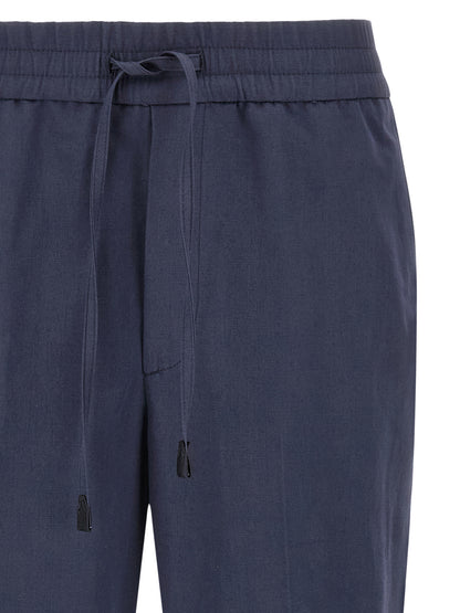 Casual Pants by Brioni for men in linen & cotton blue presents a refined pantology silhouette, artfully defined by a refined pantology straight-leg, long, and a sophisticated .