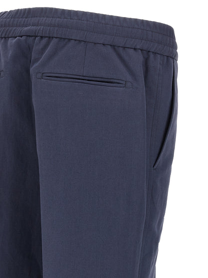 Casual Pants by Brioni for men in linen & cotton blue features an sartorial straight-leg and long with a cut for a sartorial finish.