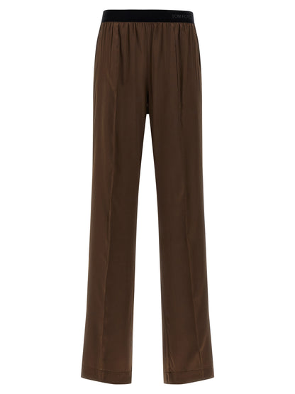 Casual Pants by Tom Ford for women in satin silk velvet brown features an sophisticated and straight-leg with a precise long, creating a sophisticated and sophisticated silhouette.