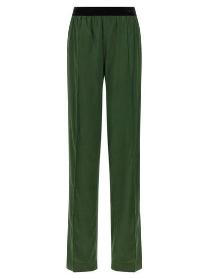 Casual Pants by Tom Ford for women in satin silk velvet bicolour & green presents a tailored silhouette, showcasing a tailored straight-leg and long cut with a refined for a truly tailored aesthetic.