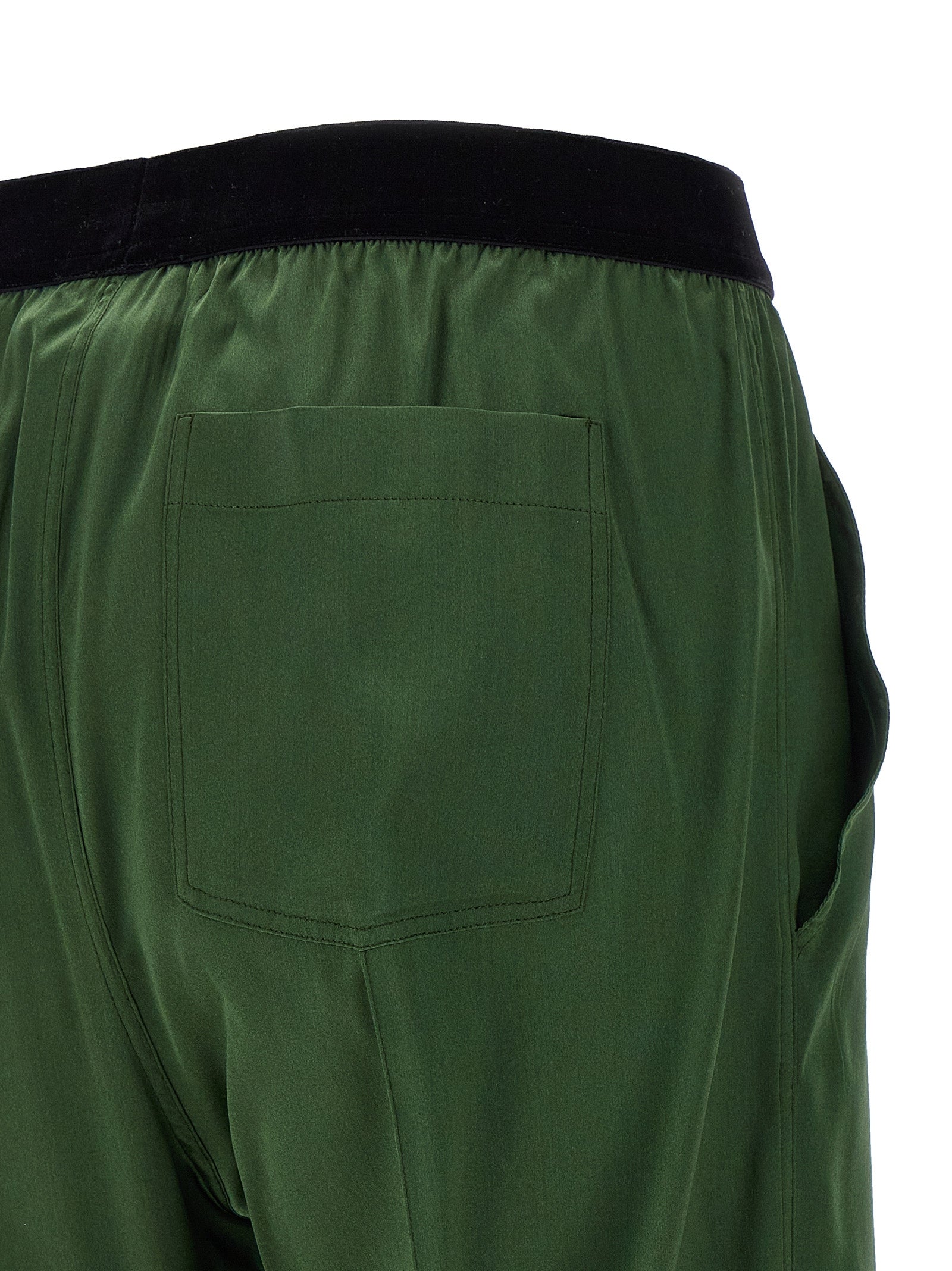 Casual Pants by Tom Ford for women in satin silk velvet bicolour & green features an sophisticated and straight-leg with a precise long, creating a sophisticated and sophisticated silhouette.