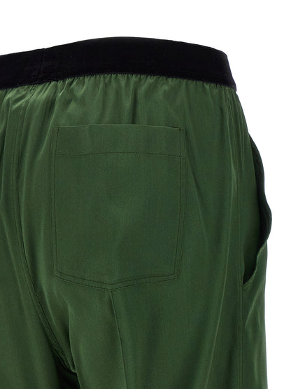 Casual Pants by Tom Ford for women in satin silk velvet bicolour & green features an sophisticated and straight-leg with a precise long, creating a sophisticated and sophisticated silhouette.