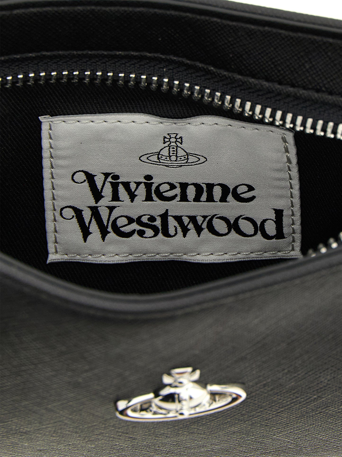 Shoulder Bag by Vivienne Westwood for women in polyethylene polyurethane & cotton black features an effortlessly chic silhouette with a secure zipper, ample , and versatile shoulder-strap, adjustable-strap & handle for effortlessly chic everyday luxury.