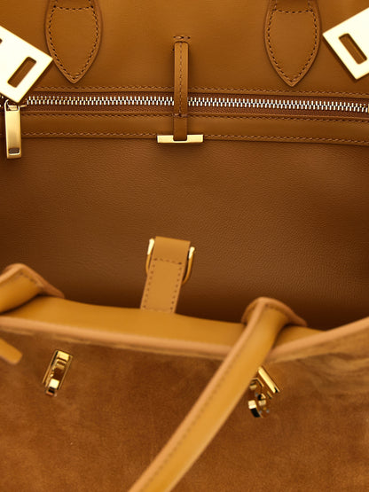Handbag by Ferragamo for women in suede leather beige features a refined silhouette, showcasing a secure , organized , and versatile shoulder-strap & adjustable-strap for a refined finish.