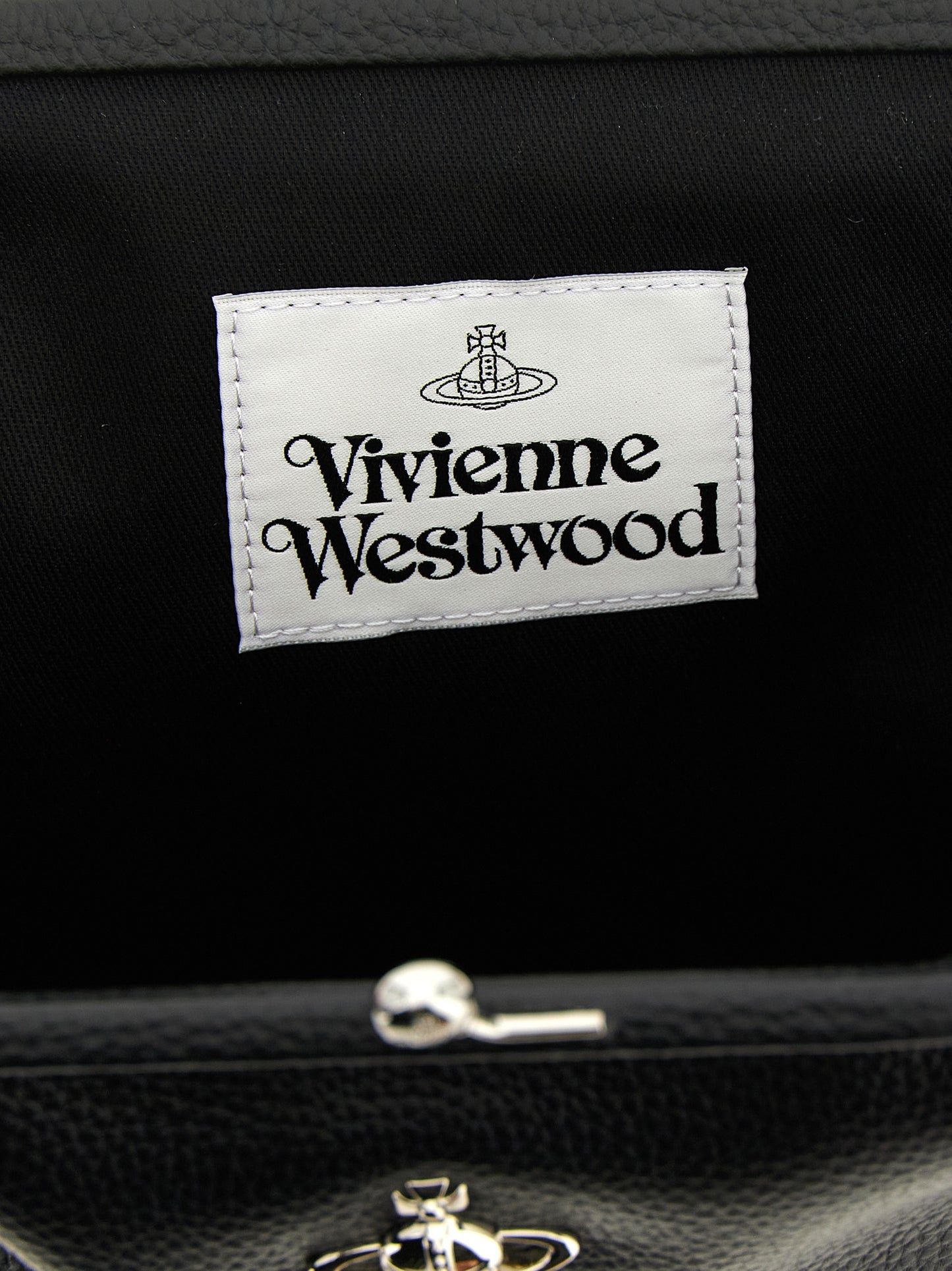 Clutch Handbag by Vivienne Westwood for women in polyethylene & polyurethane black features a statuesque silhouette, showcasing a secure snap and organized with versatile handle for statuesque evening wear.