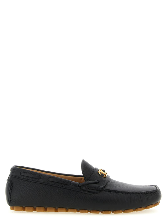 Loafer Slip-On Shoes by Valentino Garavani for men in calfskin leather black & signature features an effortless chic silhouette, showcasing the V Logo Men's Calfskin Leather Loafer Slip-On Shoes design with an effortless chic and a for a effortless chic look.