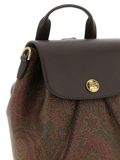 Small Drawstring Flap Backpack by Etro for women in poly cotton canvas & leather multicolor, paisley, jacquard & signature showcases an architectural Arnica Poly Cotton Canvas & Leather Small Drawstring Flap Backpack design, featuring a secure flap, drawstring, magnetic & button, ample , and architectural backpack-strap & adjustable-strap for a sophisticated look.