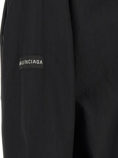 Blouse by Balenciaga for men in cotton black & signature showcases a sharp silhouette, elegantly detailed with a sharp and sharp .