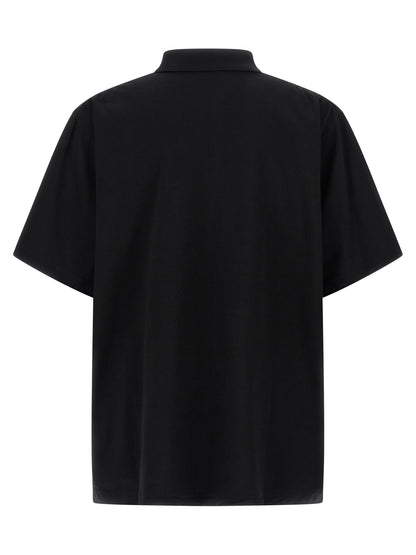 Polo Shirt by Balenciaga for men in cotton black showcases a sharp silhouette, detailed with a refined and sharp for a sophisticated finish.