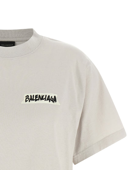 T-Shirt by Balenciaga for women in cotton gray & print features a plush silhouette, showcasing a sophisticated crew neckline and for a truly plush finish.