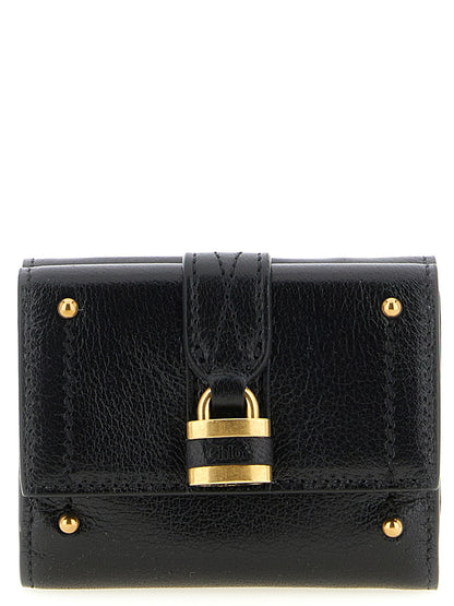Cardholder Card Case by Chloé for women in brass & buffalo leather black & gold features a distinguished silhouette, showcasing the distinguished design of the Paddington Brass & Buffalo Leather Cardholder Card Case with refined card-organization trifold.