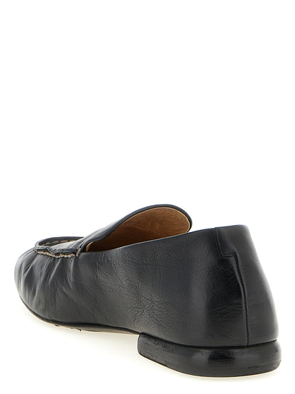 Loafer Slip-On Shoes by Marsell for men in calfskin leather black showcases a timeless silhouette from the Men's Calfskin Leather Loafer Slip-On Shoes collection, featuring a timeless and for a timeless finish.