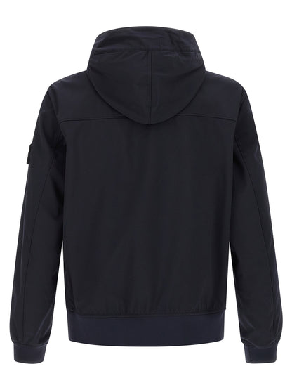 Hooded Windbreaker Jacket by Stone Island for men in stretch polyester canvas blue showcases a urban chic silhouette, detailed with a urban chic hooded high-neck neckline and functional pockets, hooded & windproof for a polished finish.
