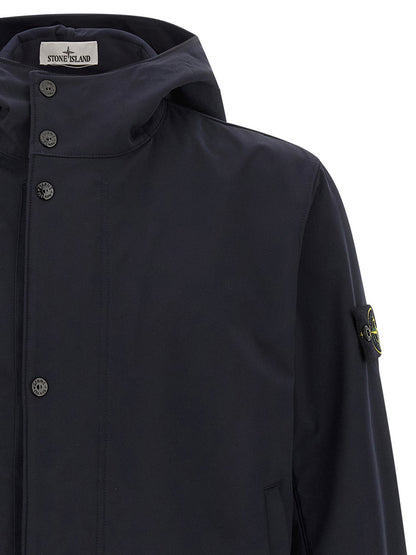 Hooded Windbreaker Jacket by Stone Island for men in stretch polyester canvas blue features an perennial silhouette with a refined hooded high-neck neckline and perennial pockets, hooded & windproof for a sophisticated weather-resistant look.