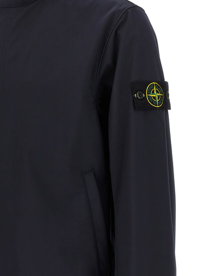 Hooded Windbreaker Jacket by Stone Island for men in stretch polyester canvas blue features an enduring silhouette, showcasing technical pockets, hooded & windproof and a sophisticated for a truly enduring aesthetic.