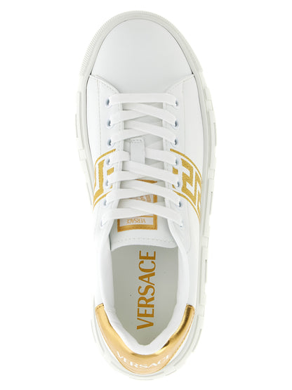 Sneakers by Versace for women in nylon leather gold presents a sumptuous silhouette, artfully capturing the essence of the Women's Fashion Nylon Leather Sneakers with its sumptuous fashion style design.