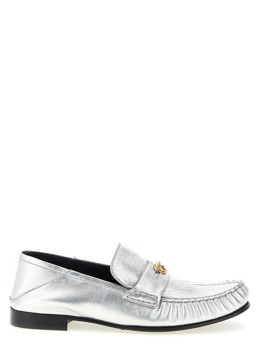 This Flat Loafer Slip-On Shoes by Versace for women in nappa lamb leather silver features an exquisite silhouette from the Medusa Women's Nappa Lamb Leather Flat Loafer Slip-On Shoes collection, defined by a sophisticated flat and elegant .