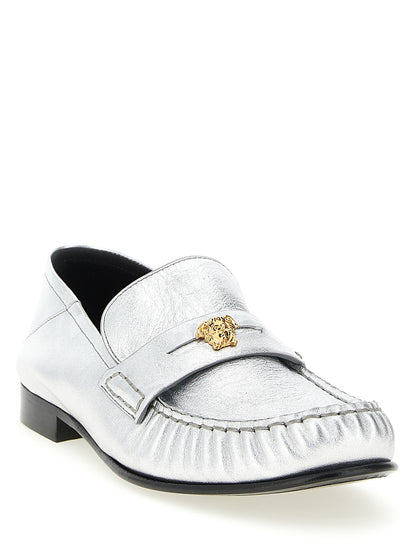 Flat Loafer Slip-On Shoes by Versace for women in nappa lamb leather silver features an ergonomic silhouette, perfectly showcasing Medusa Women's Nappa Lamb Leather Flat Loafer Slip-On Shoes with its distinct flat and elegant .