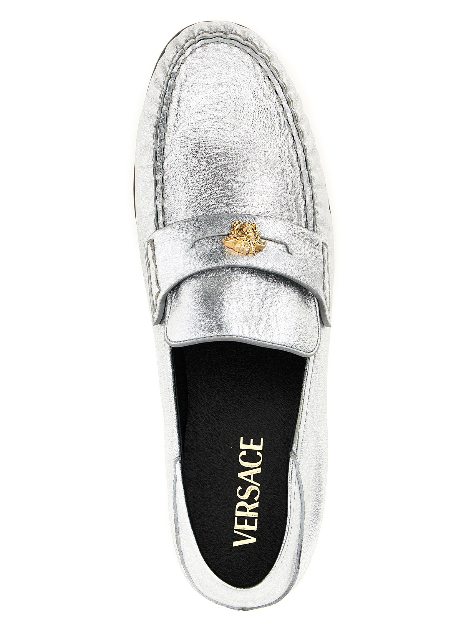 Flat Loafer Slip-On Shoes by Versace for women in nappa lamb leather silver features an dynamic silhouette from the Medusa Women's Nappa Lamb Leather Flat Loafer Slip-On Shoes collection, defined by a dynamic and flat for a dynamic look.