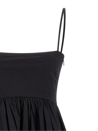 Dress by Ganni for women in stretch organic cotton black features an cute silhouette, detailed with a and square neckline that elegantly flows into a cute short mini.