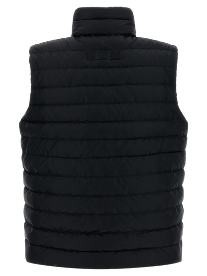 Vest by Canada Goose for women in polyamide & feathers black showcases a utilitarian silhouette, artfully incorporating pockets & insulated and a utilitarian for a truly utilitarian finish.