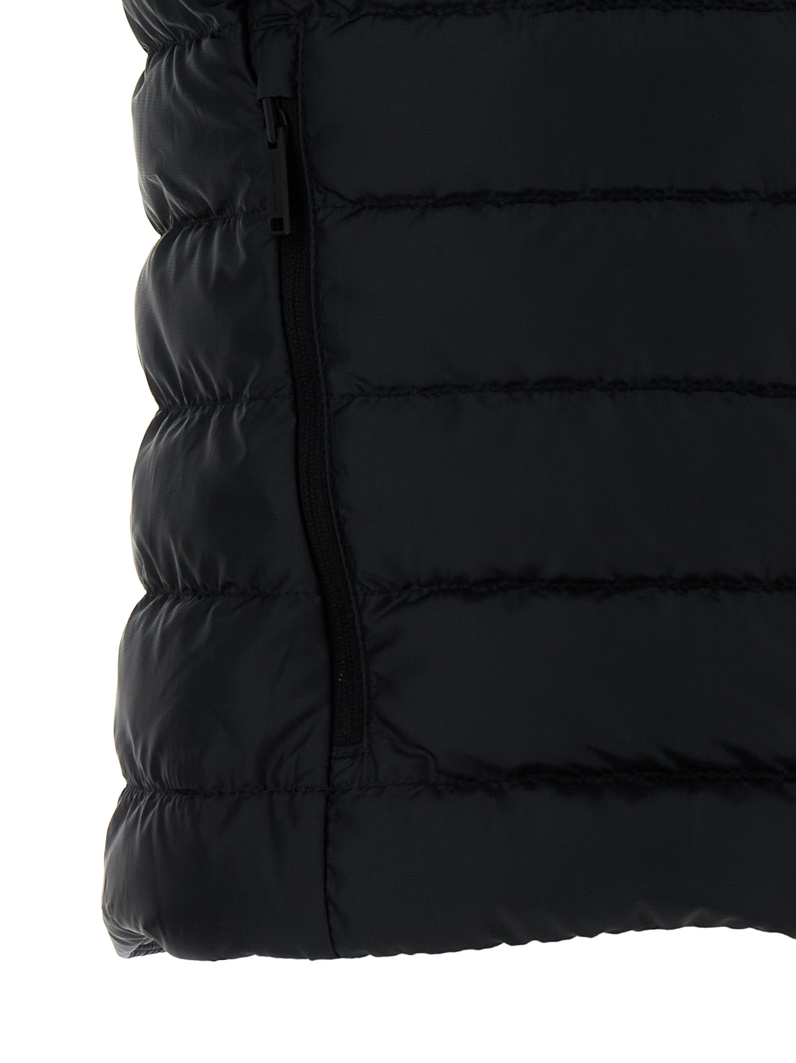 Vest by Canada Goose for women in polyamide & feathers black showcases a utilitarian silhouette, artfully incorporating pockets & insulated and a utilitarian for a truly utilitarian finish.