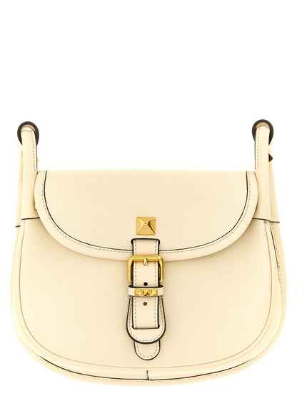 Small Shoulder Flap Bag by Valentino Garavani for women in calfskin leather white & signature features a effortless chic silhouette with a secure flap & magnetic, ample , and versatile shoulder-strap & adjustable-strap for a effortless chic finish.