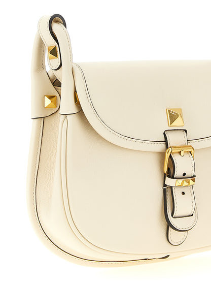 Small Shoulder Flap Bag by Valentino Garavani for women in calfskin leather white & signature showcases a enviable silhouette, artfully detailed with a secure flap & magnetic, organized , and versatile shoulder-strap & adjustable-strap for a enviable look.
