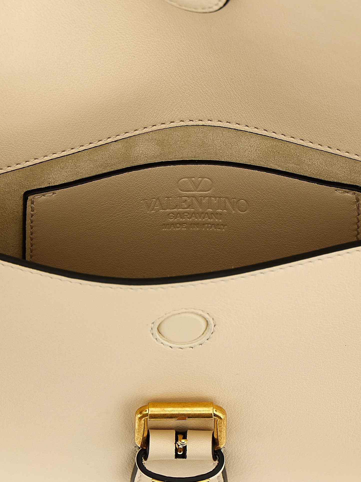 Small Shoulder Flap Bag by Valentino Garavani for women in calfskin leather white & signature features an effortlessly chic silhouette with a secure flap & magnetic, ample , and versatile shoulder-strap & adjustable-strap for effortlessly chic everyday luxury.