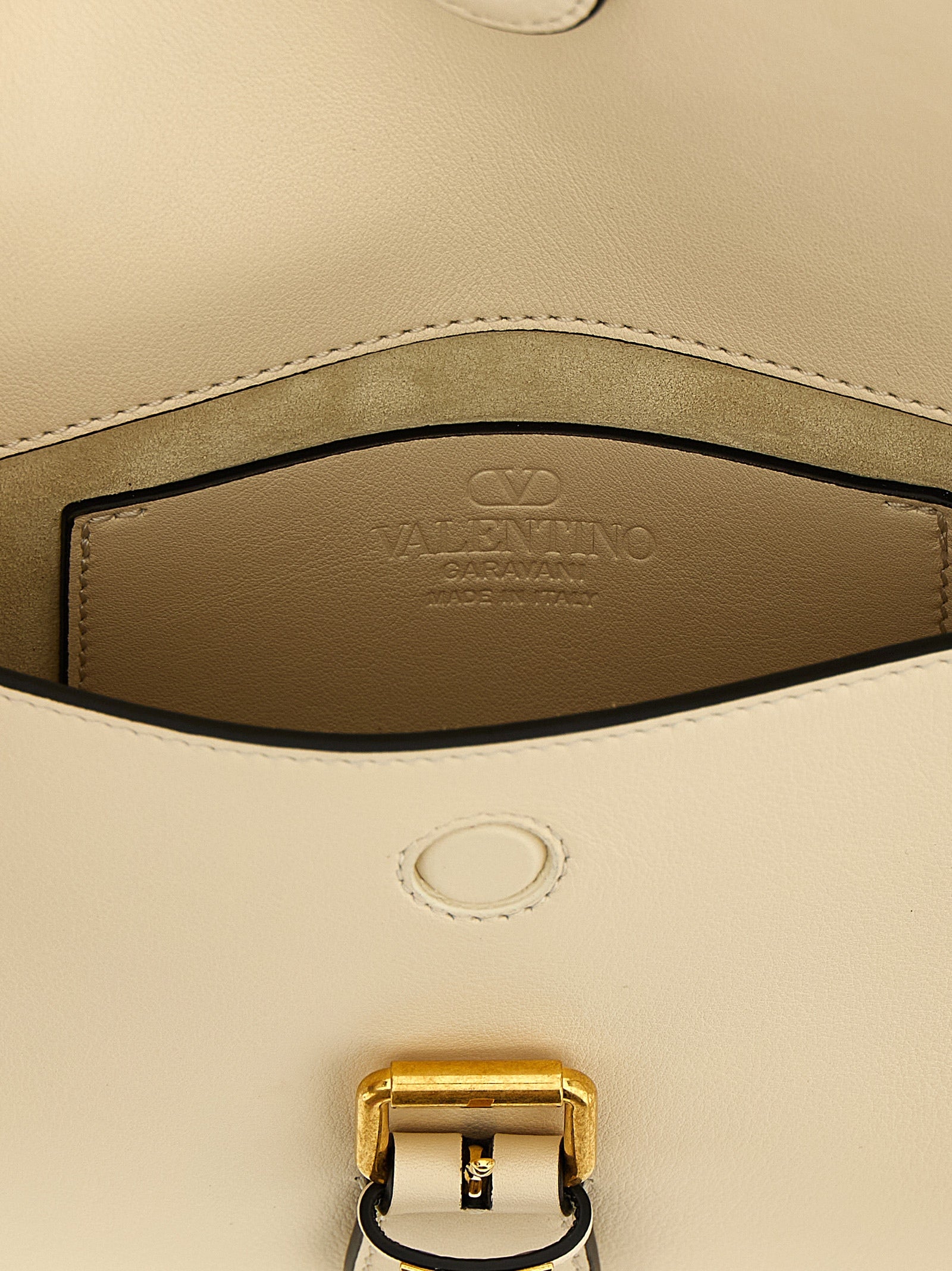 Small Shoulder Flap Bag by Valentino Garavani for women in calfskin leather white & signature features an effortlessly chic silhouette with a secure flap & magnetic, ample , and versatile shoulder-strap & adjustable-strap for effortlessly chic everyday luxury.