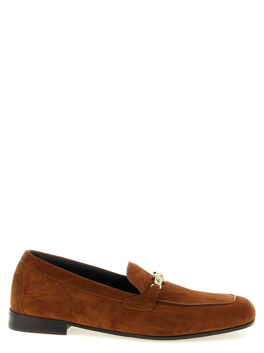 This Flat Loafer Slip-On Slippers Shoes by Versace for women in suede calfskin leather brown features an exquisite silhouette from the Medusa Women's Suede Calfskin Leather Flat Loafer Slip-On Slippers Shoes collection, defined by a sophisticated flat and elegant .