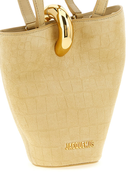 Mini Bucket Handbag by Jacquemus for women in crocodile calfskin suede leather beige features a contemporary silhouette, showcasing a secure magnetic, ample , and contemporary shoulder-strap & handle for a sophisticated look.