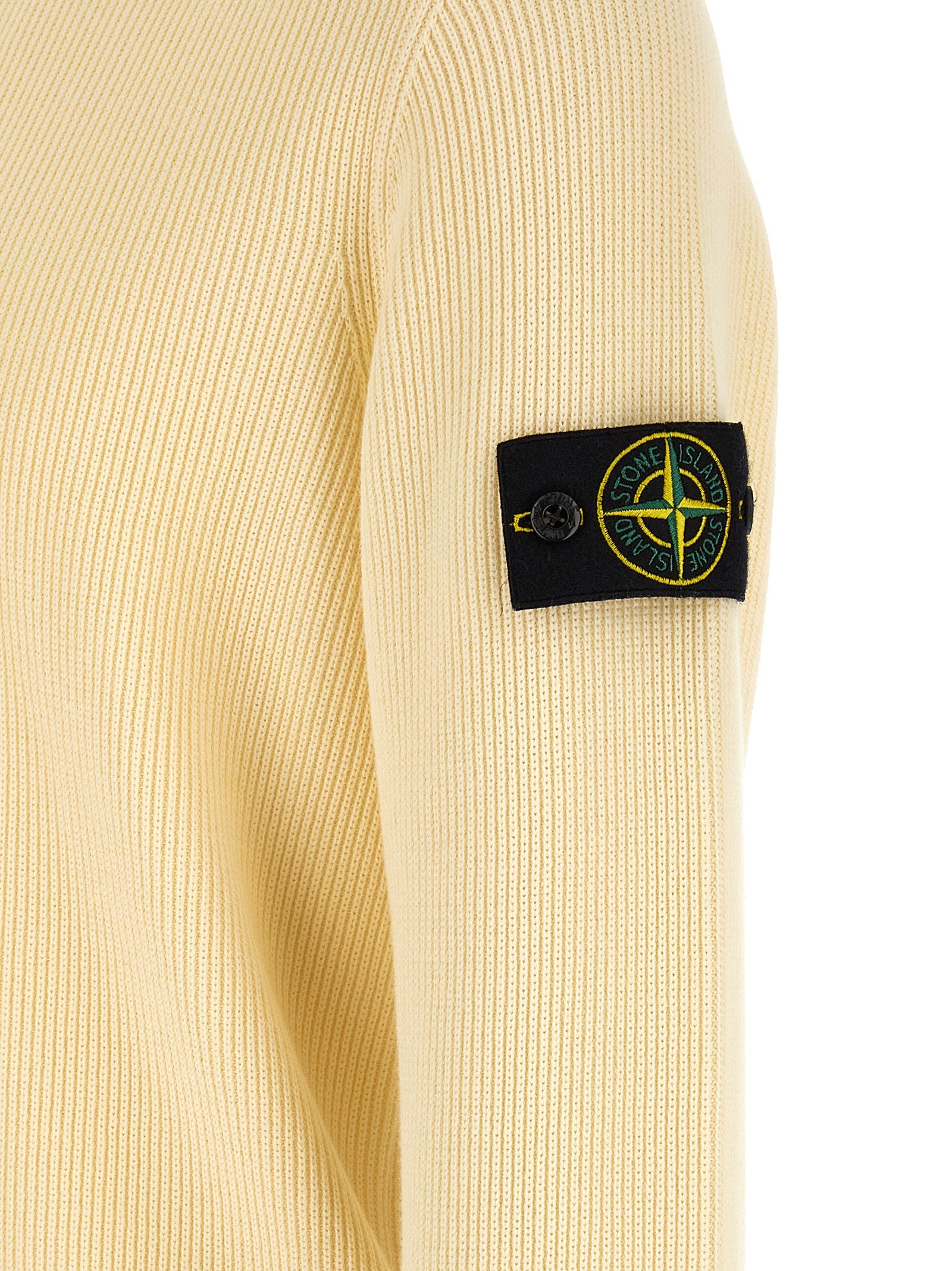 Cardigan by Stone Island for men in organic cotton beige features a dramatic silhouette, showcasing a sophisticated and dramatic detail for a timeless, premium look.