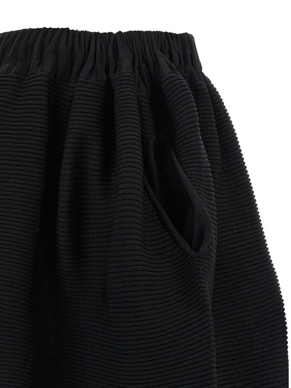 Skirt by Issey Miyake for women in polyester cotton & cupro black features a captivating silhouette, showcasing the captivating Women's Polyester Cotton & Cupro Skirt design with a sophisticated midi for a captivating look.